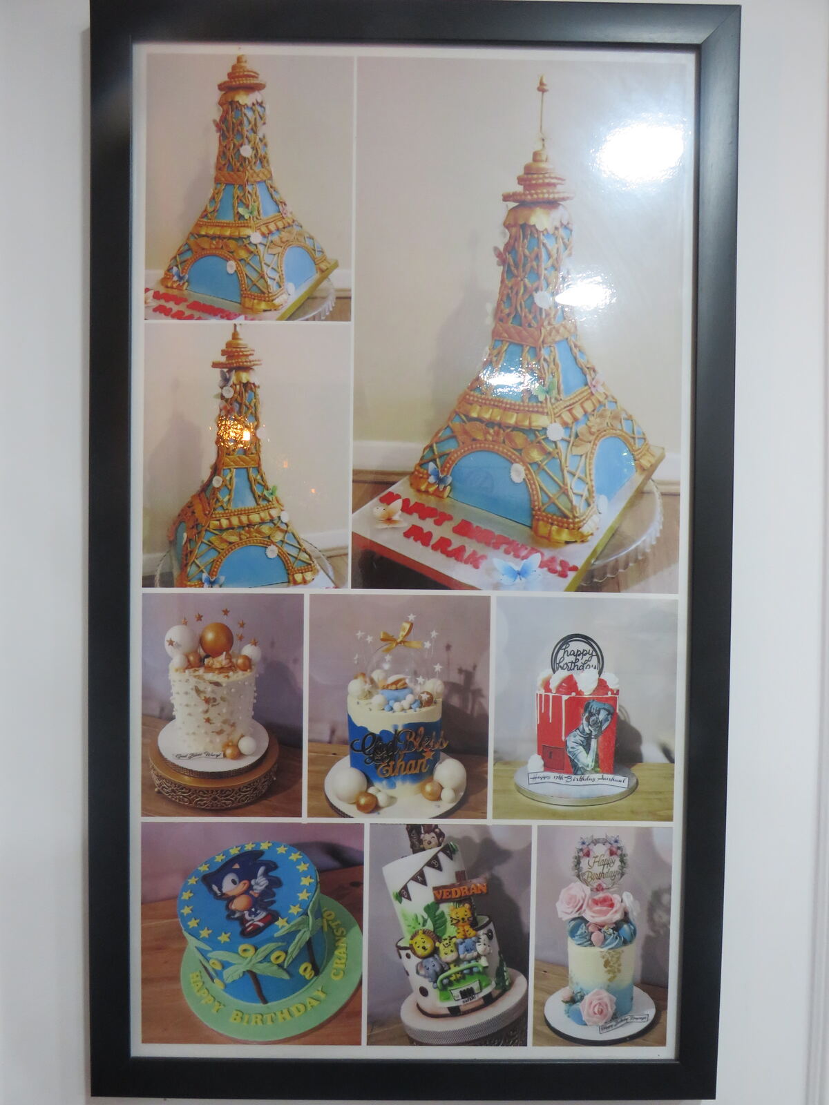 Sculpted 3D Eiffel Tower birthday cake in blue and gold fondant